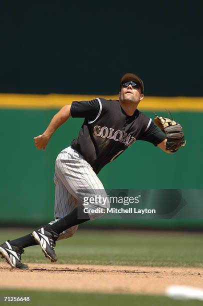 Jamey Carroll of the Colorado Rockies prepares to field a fly ball during a baseball game against the Washington Nationals on June 15, 2006 at RFK...