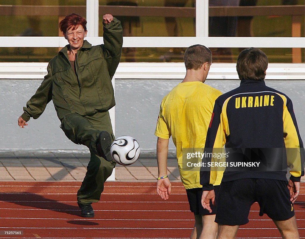 A policewoman shoots the ball back to pl