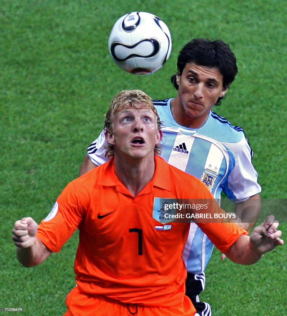Dutch forward Dirk Kuyt (front) eyes the