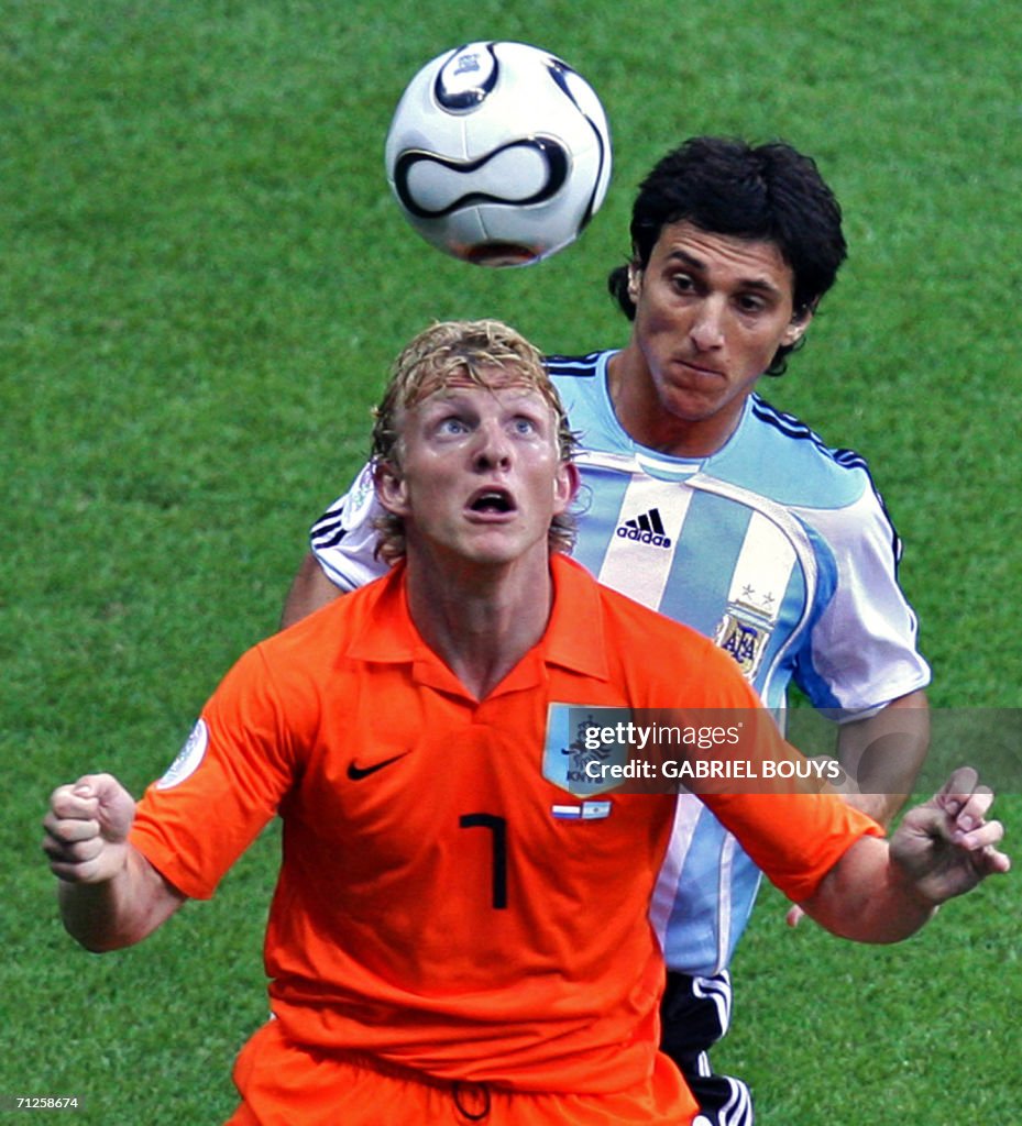 Dutch forward Dirk Kuyt (front) eyes the