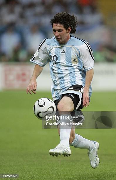 Lionel Messi of Argentina runs with the ball during the FIFA World Cup Germany 2006 Group C match between Netherlands and Argentina at the Stadium...
