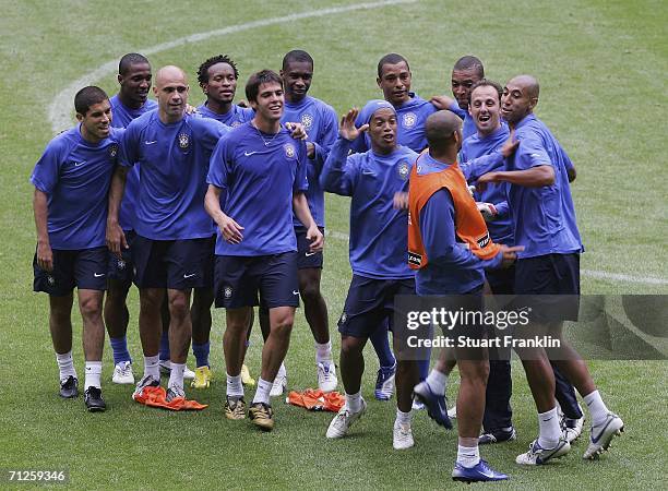 Adriano of Brazil pretends to make a fight with memebers of the victorious blue team during the training session of National Football Team Brazil on...