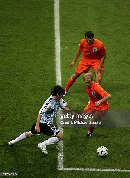 Lionel Messi of Argentina attempts to go past Tim De Cler of the Netherlands during the FIFA World Cup Germany 2006 Group C match between Netherlands...