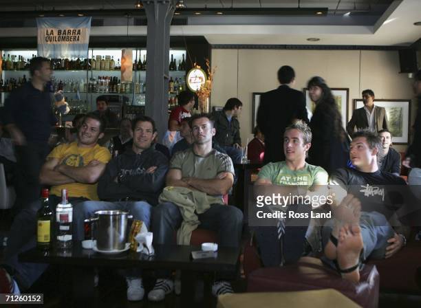 All Blacks Richie McCaw, Leon MacDonald, Graham Lowe , Jimmy Cowan and Ali Williams relax in a local bar as they watch the World Cup Football match...