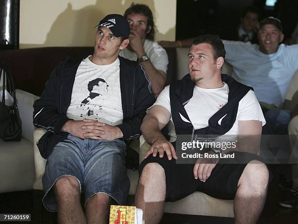 All Blacks Craig Newby and Tony Woodcock relax in a local bar as they watch the World Cup Football match between Argentina and Holland on June 21,...