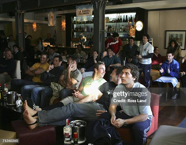 All Blacks Richie McCaw, Leon MacDonald, Graham Lowe , Jimmy Cowan, Ali Williamsand local team liason Manuel Dolcemelo relax in a local bar as they...