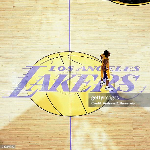 Kobe Bryant of the Los Angeles Lakers stands at center court against the Indiana Pacers during Game One of the 2000 NBA Finals played June 7, 2000 at...
