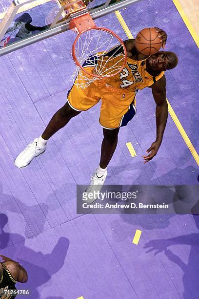 Shaquille O'Neal of the Los Angeles Lakers elevates for a dunk against the Indiana Pacers during Game One of the 2000 NBA Finals played June 7, 2000...