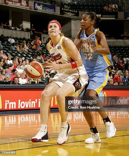 Linda Frohlich of the Indiana Fever looks to score on Stacey Lovelace-Tolbert of the Chicago Sky on June 21, 2006 at Conseco Fieldhouse in...