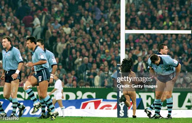 Streaker runs onto the ground during the ARL State of Origin match between the Queensland Maroons and the New South Wales Blues at the Melbourne...