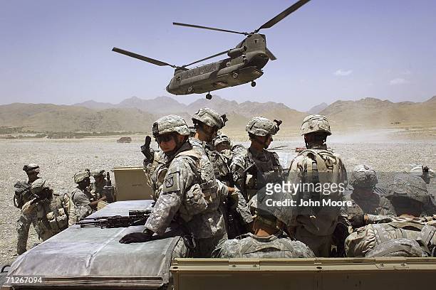 American soldiers from the 10th Mountain Division deploy to fight Taliban fighters as part of Operation Mountain Thrust to a U.S. Base near the...
