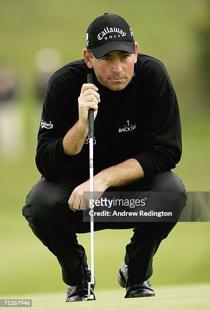 Thomas Bjorn of Denmark lines up his birdie putt on the ninth hole during the first round of The Johnnie Walker Championship on The PGA Centenary...