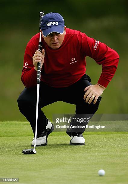 Ian Woosnam of Wales lines up his putt on the first hole during the first round of The Johnnie Walker Championship on The PGA Centenary Course at...