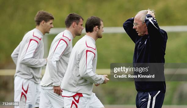 Sven Goran Eriksson the England coach watches his players during the teams training session at the England World Cup base on June 22, 2006 in...