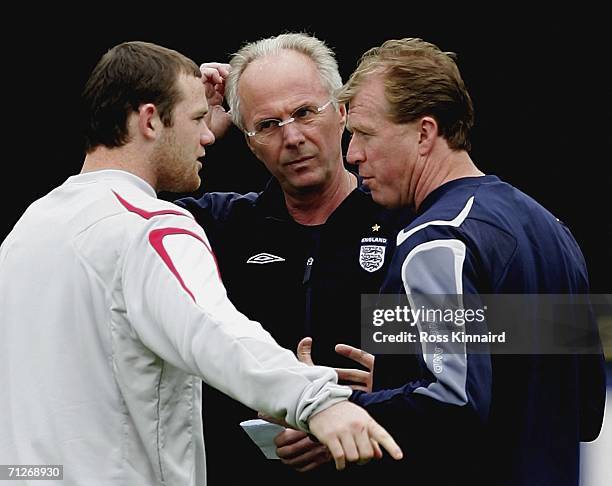 Wayne Rooney of England talks to Sven Goran Eriksson and Steve McClaren during the teams training session at the England World Cup base on June 22,...