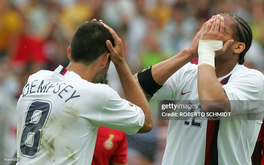 US midfielder Clint Dempsey (L) and US d