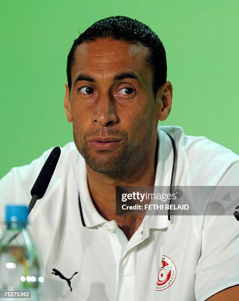 Berlin-Schonefeld Apt, GERMANY: Tunisian goalkeeper Ali Boumnijel addresses a press conference after a training session at The Olympic Stadium in...