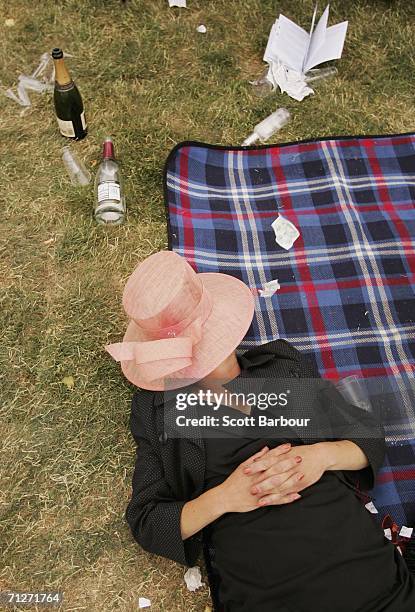 Race-goer takes a rest on Ladies Day, the third day of Royal Ascot at the Ascot Racecourse on June 22, 2006 in Berkshire, England. The event has been...