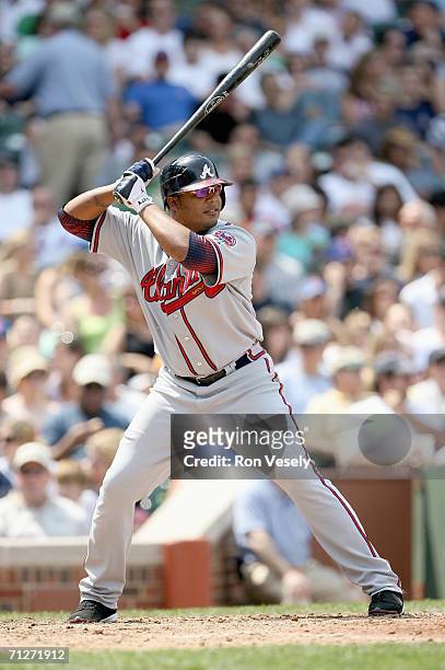 Andruw Jones of the Atlanta Braves waits for the upcoming pitch against the Chicago Cubs at Wrigley Field in Chicago, Illinois on May 27, 2006. The...