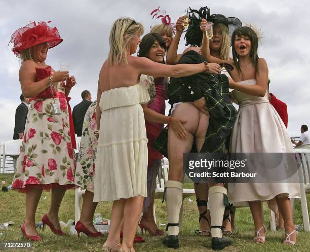 Race goers enjoy the atmosphere at Ladies' Day during the third day of Royal Ascot at the Ascot Racecourse on June 22, 2006 in Berkshire, England....