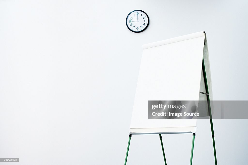 Blank flipchart in office