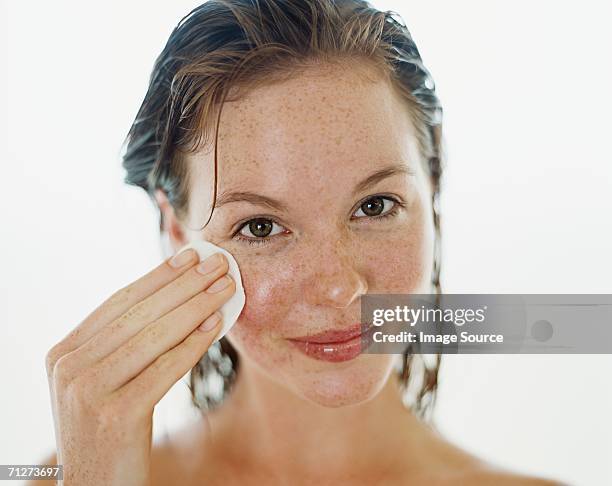 portrait of a young adult woman - removing make up stock pictures, royalty-free photos & images