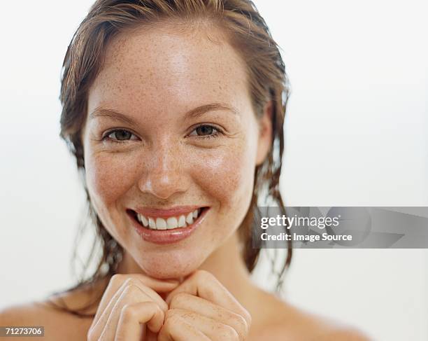 portrait of a young adult woman - freckle stock pictures, royalty-free photos & images