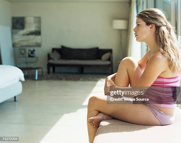 Young woman sitting indoors