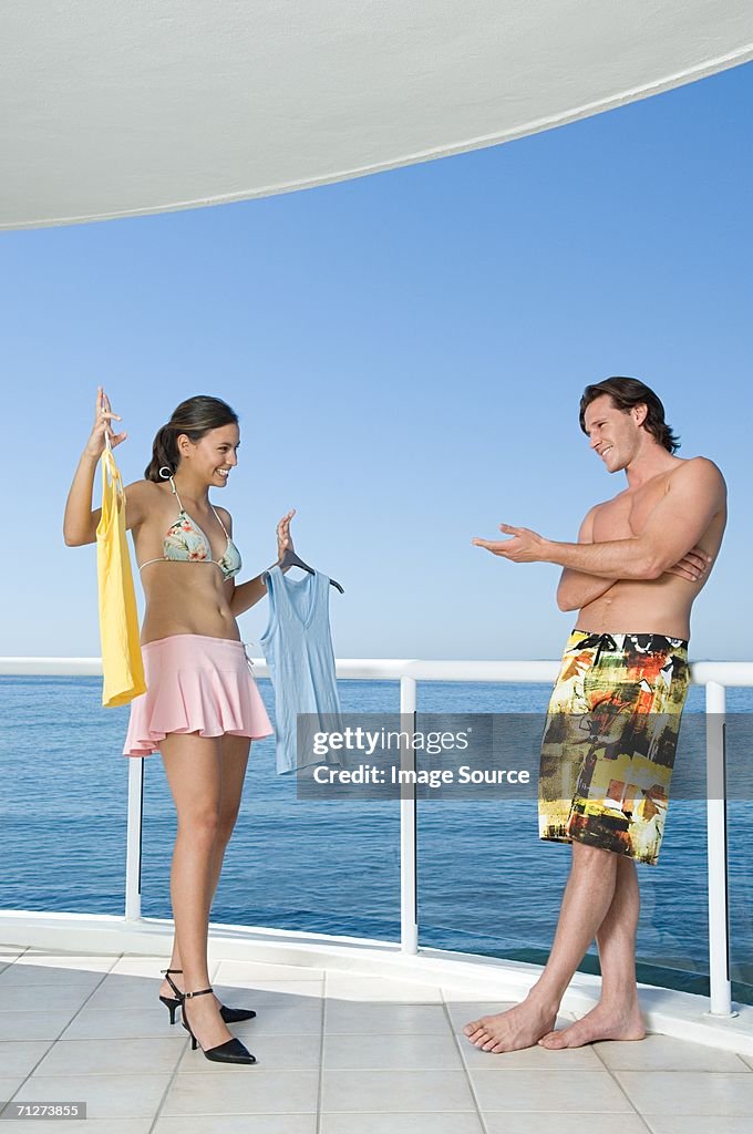 Woman showing clothing to boyfriend