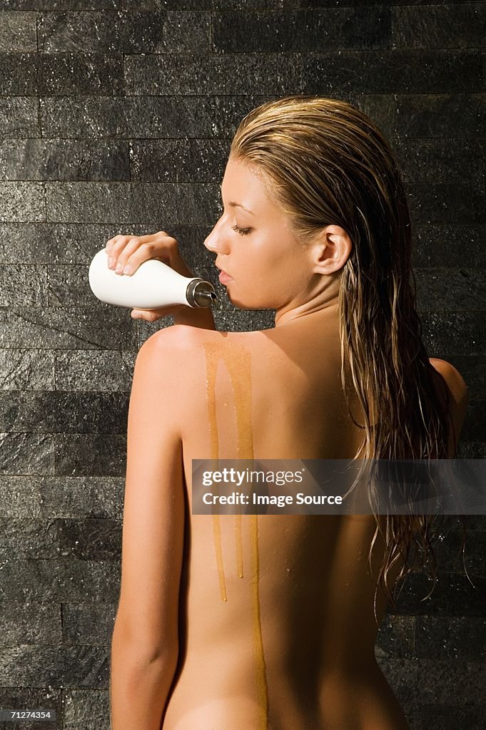 Woman using massage oil