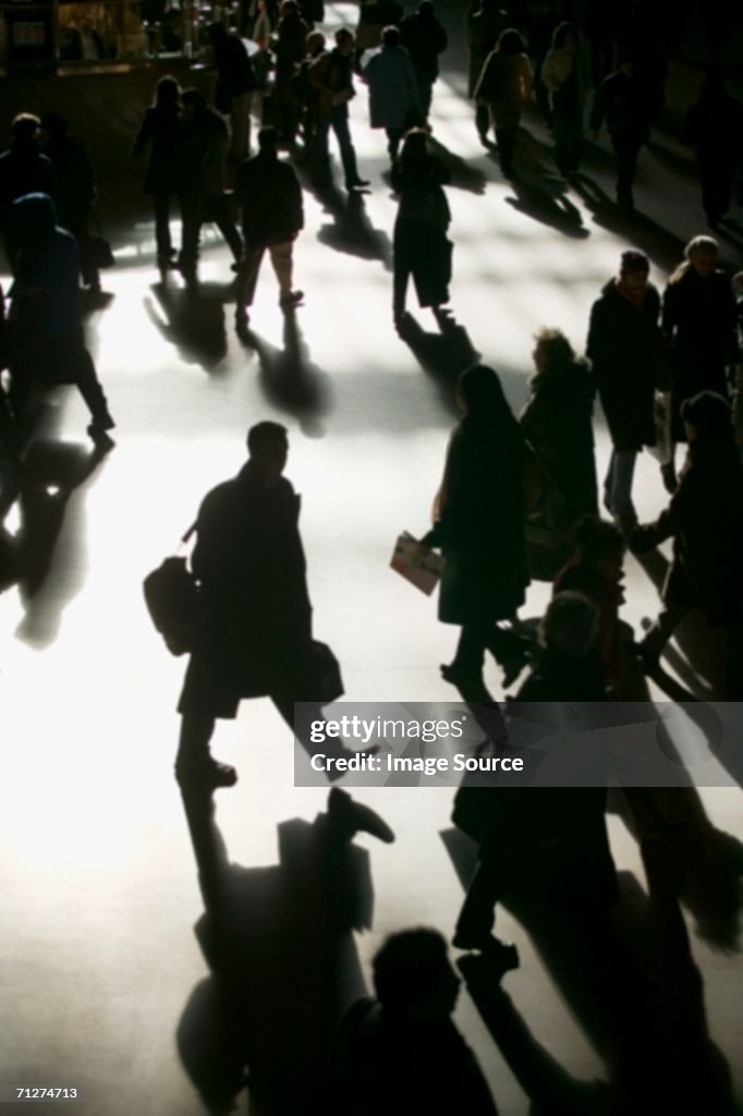 Commuters in silhouette