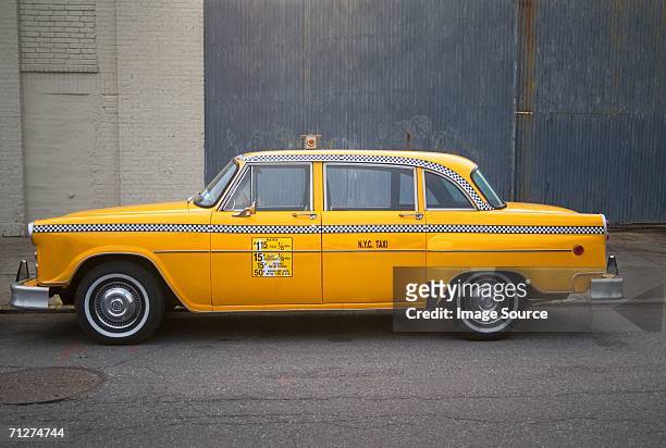 parked yellow taxi cab new york - taxi stock pictures, royalty-free photos & images