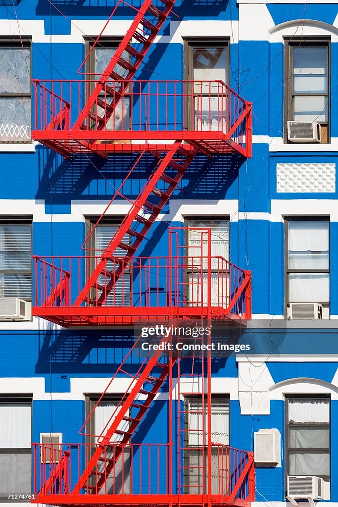 Apartment building with fire escapes