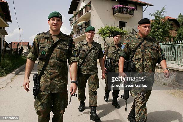German EUFOR soldiers patrol June 22, 2006 in the Muslim village of Zupca, near Sarajevo in Bosnia and Hercegovina. More than 1,000 Germans make up...