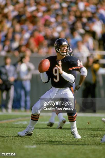 Quarterback Jim McMahon of the Chicago Bears drops back to pass against the Dallas Cowboys at Soldier Field on October 16, 1988 in Chicago, Illinois....