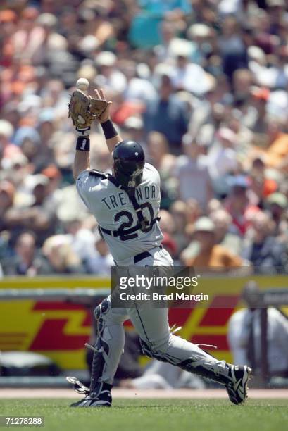 Matt Treanor of the Florida Marlins plays a fly ball during the game against the San Francisco Giants at AT&T Park in San Francisco, California on...
