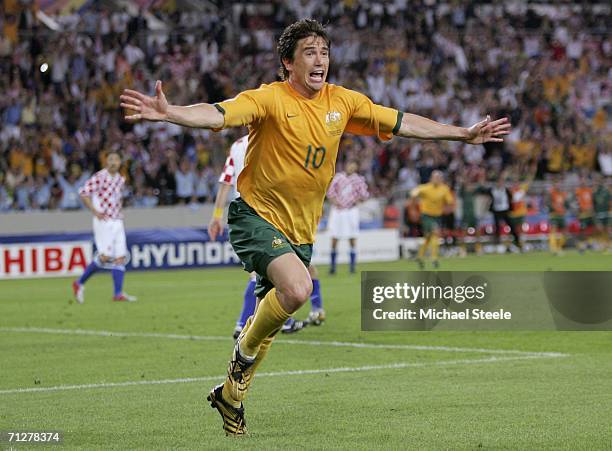 Harry Kewell of Australia turns away to celebrate, after scoring his team's second goal to level the scores at 2-2 during the FIFA World Cup Germany...