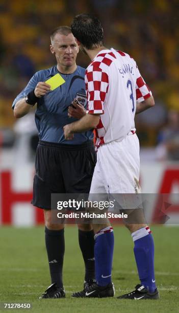 Josip Simunic of Croatia is shown a yellow card by English referee Graham Poll during the FIFA World Cup Germany 2006 Group F match between Croatia...
