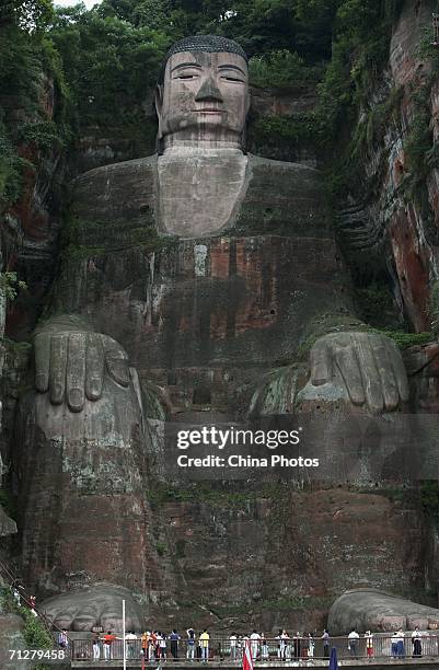 Tourists visit the Leshan Giant Buddha on June 22, 2006 in Leshan of Sichuan Province, China. The statue, built in 713 during the Tang Dynasty, is 71...