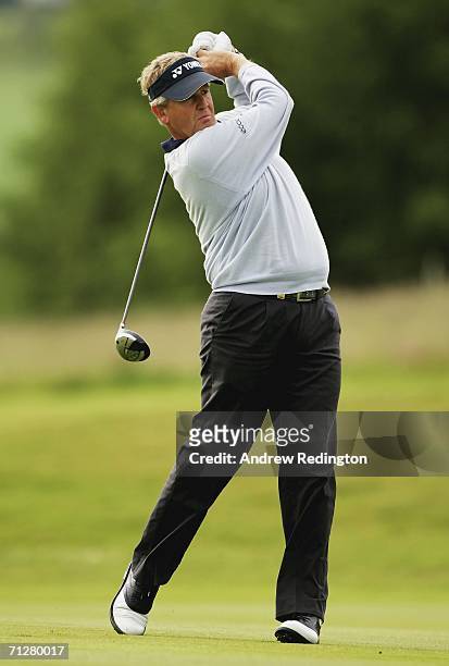 Colin Montgomerie of Scotland hits his second shot on the 12th hole during the second round of The Johnnie Walker Championship on The PGA Centenary...
