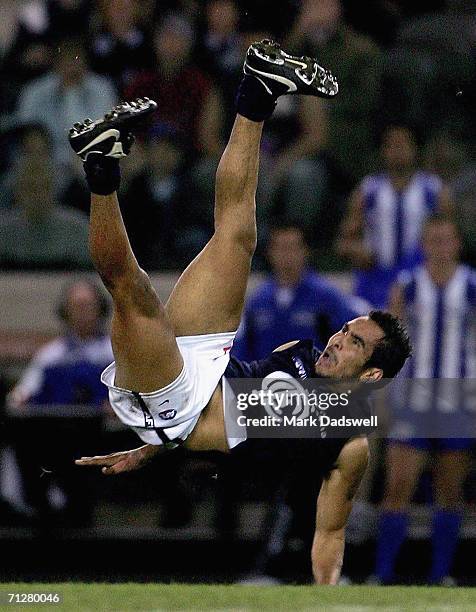 Eddie Betts of the Blues crashes to the ground during the round 12 AFL match between the Kangaroos and Carlton at the Telstra Dome on June 23, 2006...