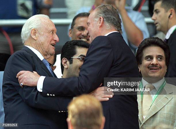 Kaiserslautern, GERMANY: Spain's King Juan Carlos greets the former president of FIFA Joao Havelange as president of the Saudi Arabia Football...