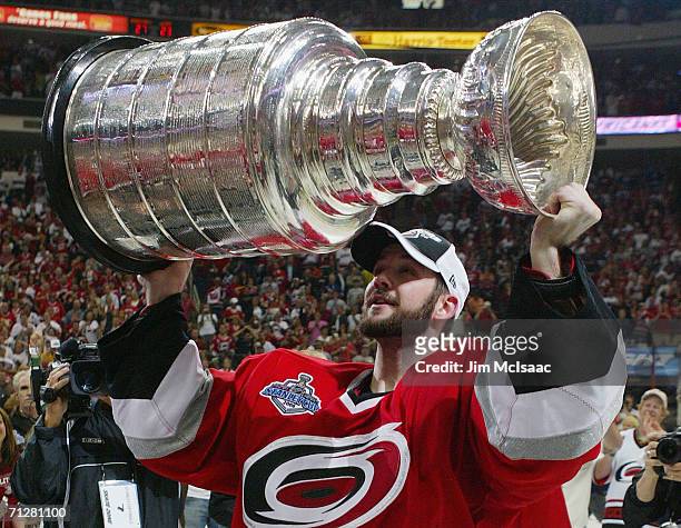 Cam Ward of the Carolina Hurricanes celebrates with the Stanley Cup after defeating the Edmonton Oilers in game seven of the 2006 NHL Stanley Cup...