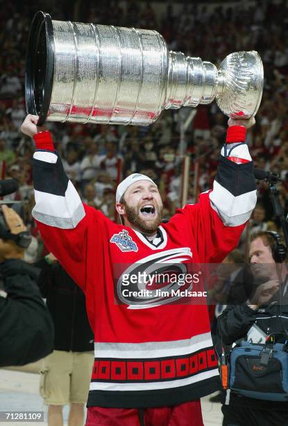 Erik Cole of the Carolina Hurricanes celebrates with the Stanley Cup after defeating the Edmonton Oilers in game seven of the 2006 NHL Stanley Cup...