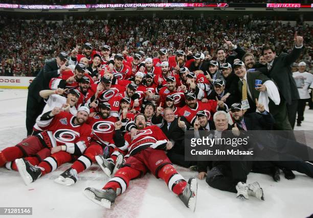 The Carolina Hurricanes pose together with the Stanley Cup after defeating the Edmonton Oilers in game seven of the 2006 NHL Stanley Cup Finals on...