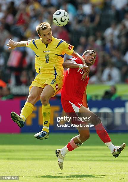 Oleg Gusev of Ukraine beats Anis Ayari of Tunisia to the ball during the FIFA World Cup Germany 2006 Group H match between Ukraine and Tunisia played...