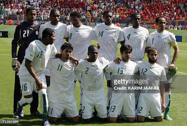 Kaiserslautern, GERMANY: The Saudi Arabia team pose at the start of the opening round Group H World Cup football match between Saudi Arabia and Spain...