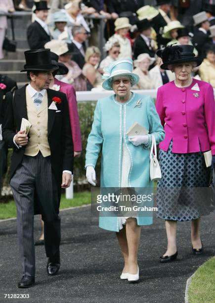 Queen Elizabeth II accompanied by a racing friend and Lady-in-waiting Mary Morrison, attends the fourth day of Royal Ascot Races on June 23, 2006 in...