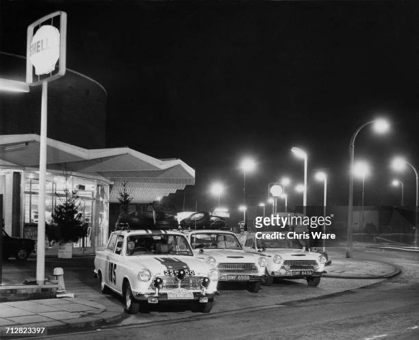 The John Willment Racing Team Ford Cortina GT team prepare for the Monte Carlo Rally from a Shell petrol station on 16 January 1964 at Twickenham,...