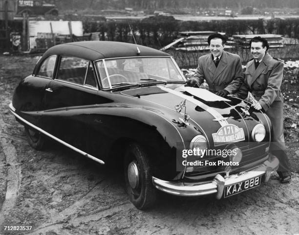 Brothers Laurie and Bert Leader stand beside their Austin A90 Atlantic sports coupe before the start of the Monte Carlo Rally on 16 January 1953 at...